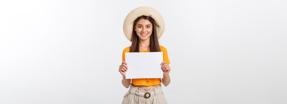 Woman holding blank card. Isolated on white background smiling female portrait.