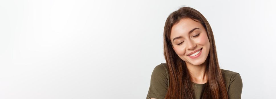 Portrait of a beautiful young woman looking at the camera and smiling, isolated on a white background