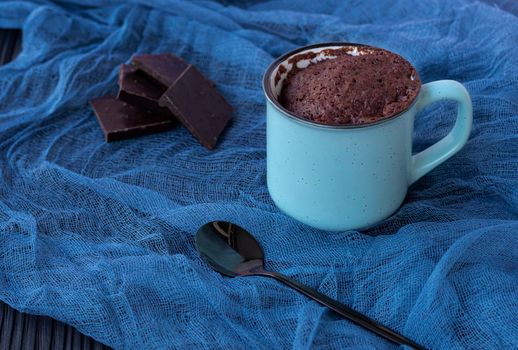 dessert. Mugcake. Quick chocolate cake in a mug. Homemade Chocolate Microwave Mug Brownie Ready to Eat. Fast cooking in the microwave. Copy space. . High quality photo