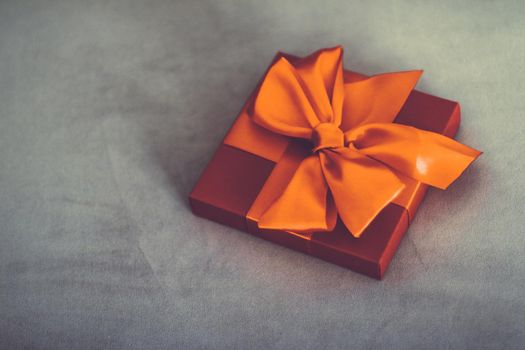 Birthday present, shop sale promotion and autumn decoration concept - Vintage luxury holiday orange gift box with silk ribbon and bow, christmas or valentines day decor