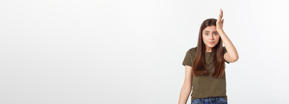 Girl with a suspicious look and hand on her side on a white isolated background