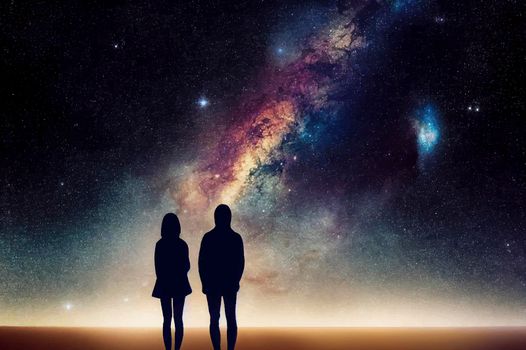 silhouette of couple with night scene milky way background in the galaxy.