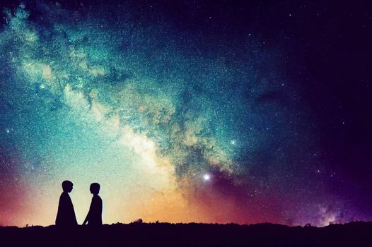 silhouette of couple with night scene milky way background in the galaxy.