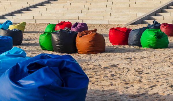Shot of a colorful beanbags on the beach.