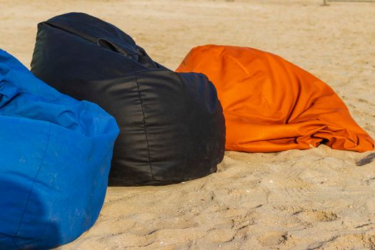 Shot of a colorful beanbags on the beach.