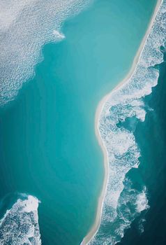 Beach and waves from above. water background from the top. Summer attacks from the air. Aerial view of a blue ocean.