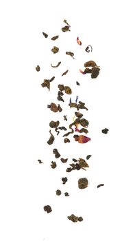 Falling dried tea leaves isolated on white background.