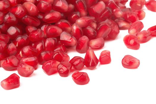 Pomegranate seeds isolated on a white background