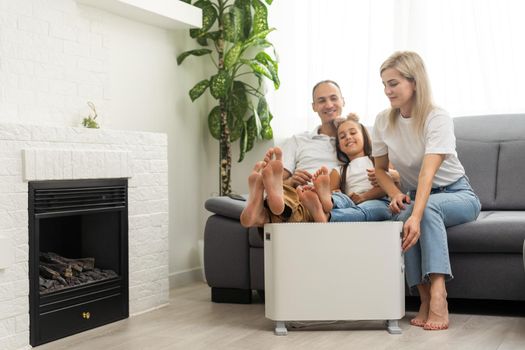 Modern electric heater on floor at home.