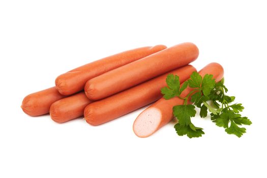 Fresh sausages with parsley leaves isolated on white background