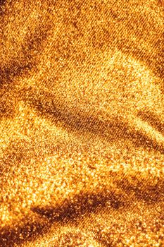 Luxe glowing texture, night club branding and New Years party concept - Golden holiday sparkling glitter abstract background, luxury shiny fabric material for glamour design and festive invitation