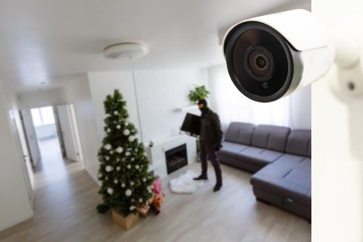 CCTV Camera Showing A Burglar Stealing Things In The House
