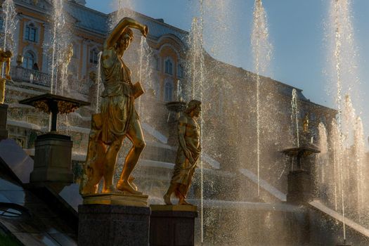 RUSSIA, PETERSBURG - AUG 19, 2022: fountain petersburg russia palace peterhof grand st heritage golden, for baroque park for gold from peter sky, dome cross. Flow waterfall luxury,