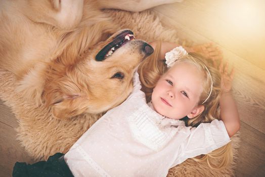 Hes my home dog. An adorable little girl with her dog at home