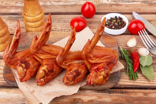 Smoked chicken wings on a wooden surface
