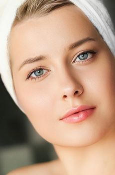 Skin care and beauty routine, beautiful woman with white towel wrapped around head, skincare cosmetics and face cosmetology, close-up portrait