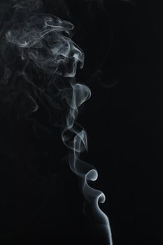 Abstract Smoke swirls on black background