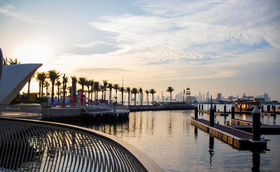 View of a Dubai city skyline from the wharf on Dubai creek harbour. UAE.