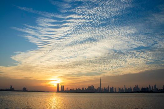 Dramatic sunset over a Dubai city. UAE.