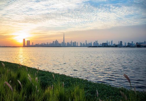 Dramatic sunset over a Dubai city. UAE.
