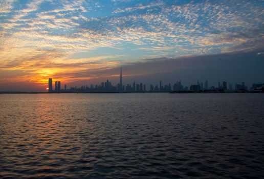 Dramatic sunset over a Dubai city. UAE.