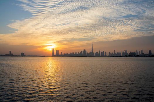 Dramatic sunset over a Dubai city. UAE.