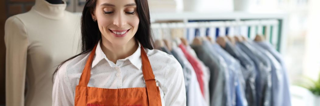 Dry cleaning administrator woman with tablet. Dry cleaning and laundry service concept