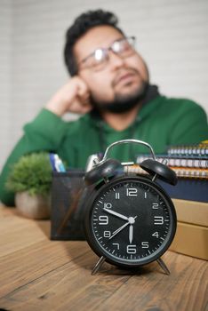 lazy young student sleeping on table ,