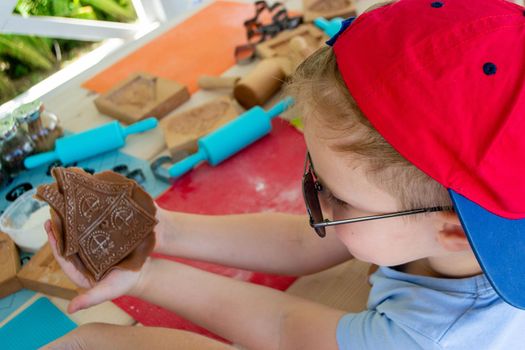 Children make homemade gingerbread cookies. High quality photo