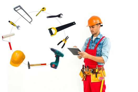 Handyman with tools and tablet