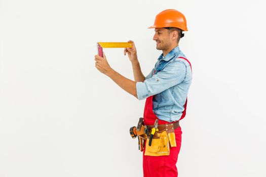 profession, construction and building - happy smiling male worker or builder in helmet over white background