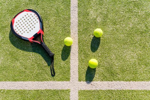 top view of paddle tennis objects on court of artificial turf, indoor sports concept and sporty lifestyle