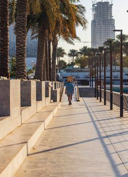 Dubai, UAE - 02.11.2022 - Senior person walking in the morning at Dubai creek harbour area