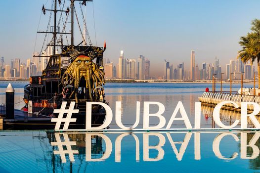 Dubai, UAE - 02.11.2022 - Replica of Black pearl pirate ship, used as a floating restaurant and docked in Dubai creek harbor.