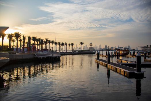 View of a Dubai city skyline from the wharf on Dubai creek harbour. UAE.