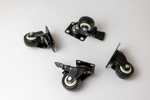 Wheels for Furniture and heavy equipment on a white isolated background with selective focus