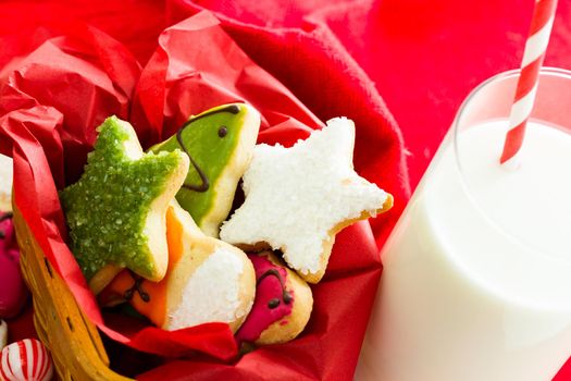 Assorted christmas cookies on red background.