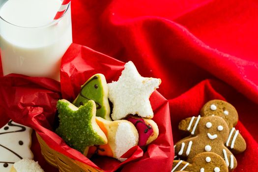 Assorted christmas cookies on red background.