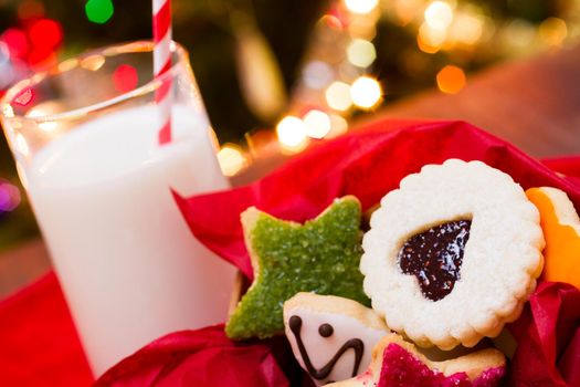 Assorted christmas cookies on red background.