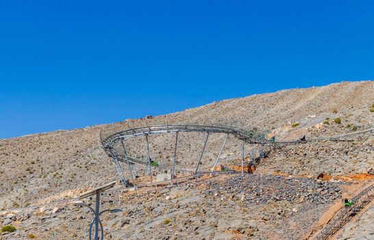 Outdoor roller coaster attraction in the mountains