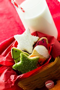 Assorted christmas cookies on red background.