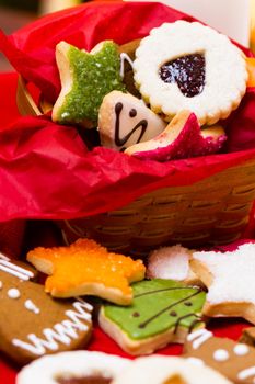 Assorted christmas cookies on red background.