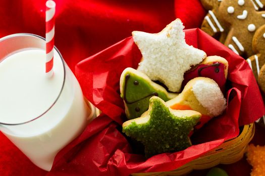 Assorted christmas cookies on red background.