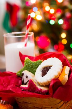 Assorted christmas cookies on red background.