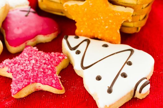 Assorted christmas cookies on red background.