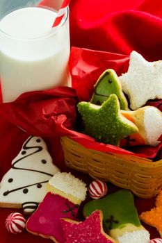 Assorted christmas cookies on red background.