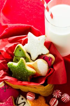 Assorted christmas cookies on red background.