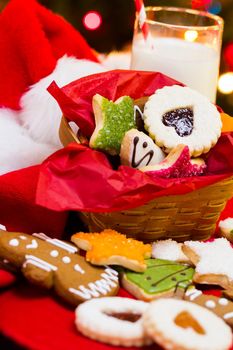 Assorted christmas cookies on red background.