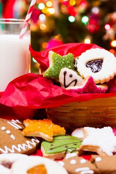 Assorted christmas cookies on red background.