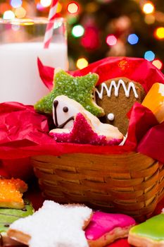 Assorted christmas cookies on red background.